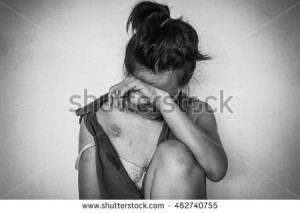 stock-photo-a-woman-sitting-on-ground-with-arm-on-knee-and-lower-head-bruises-on-body-sexual-violence-462740755
